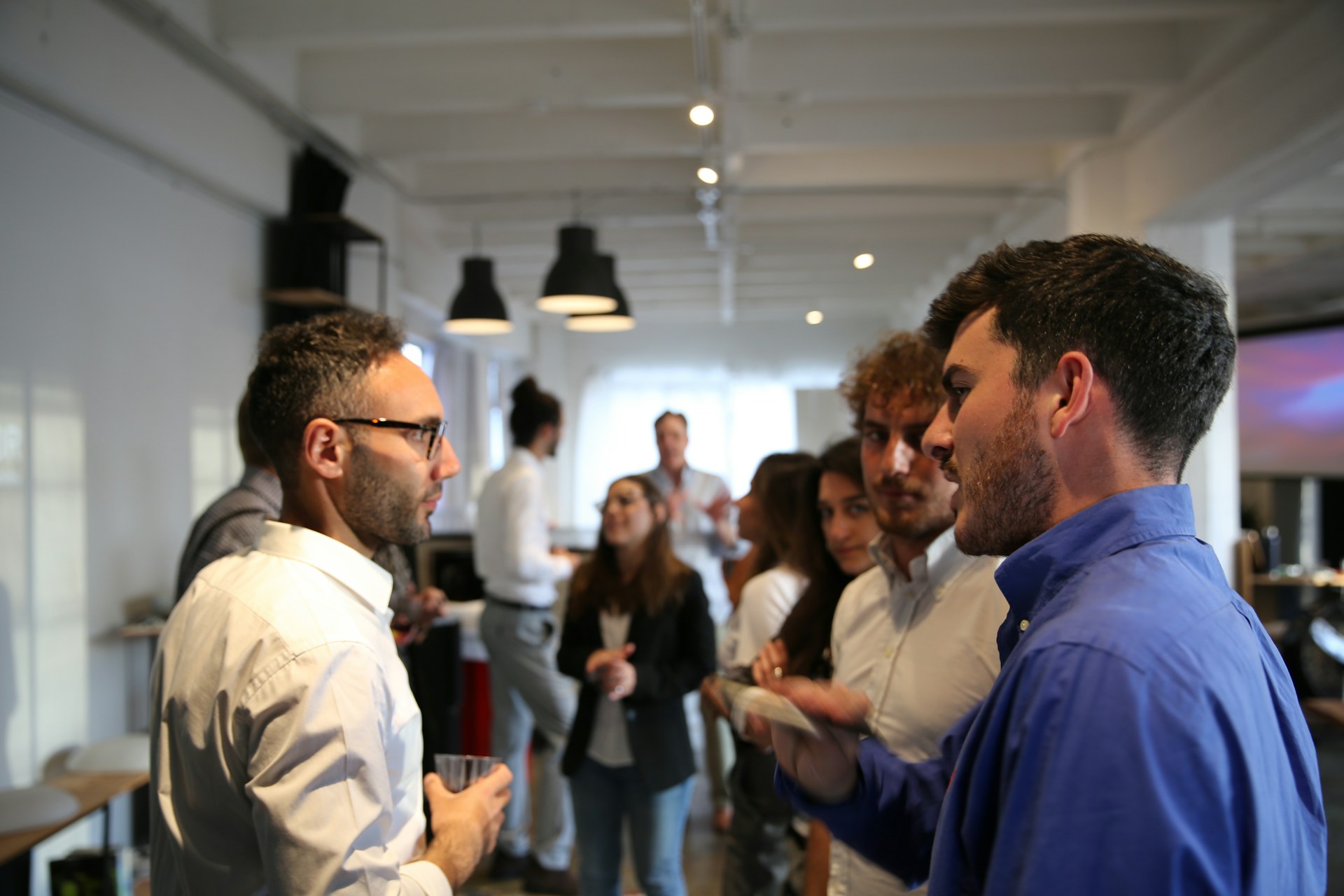 Professionals talking at a business networking event